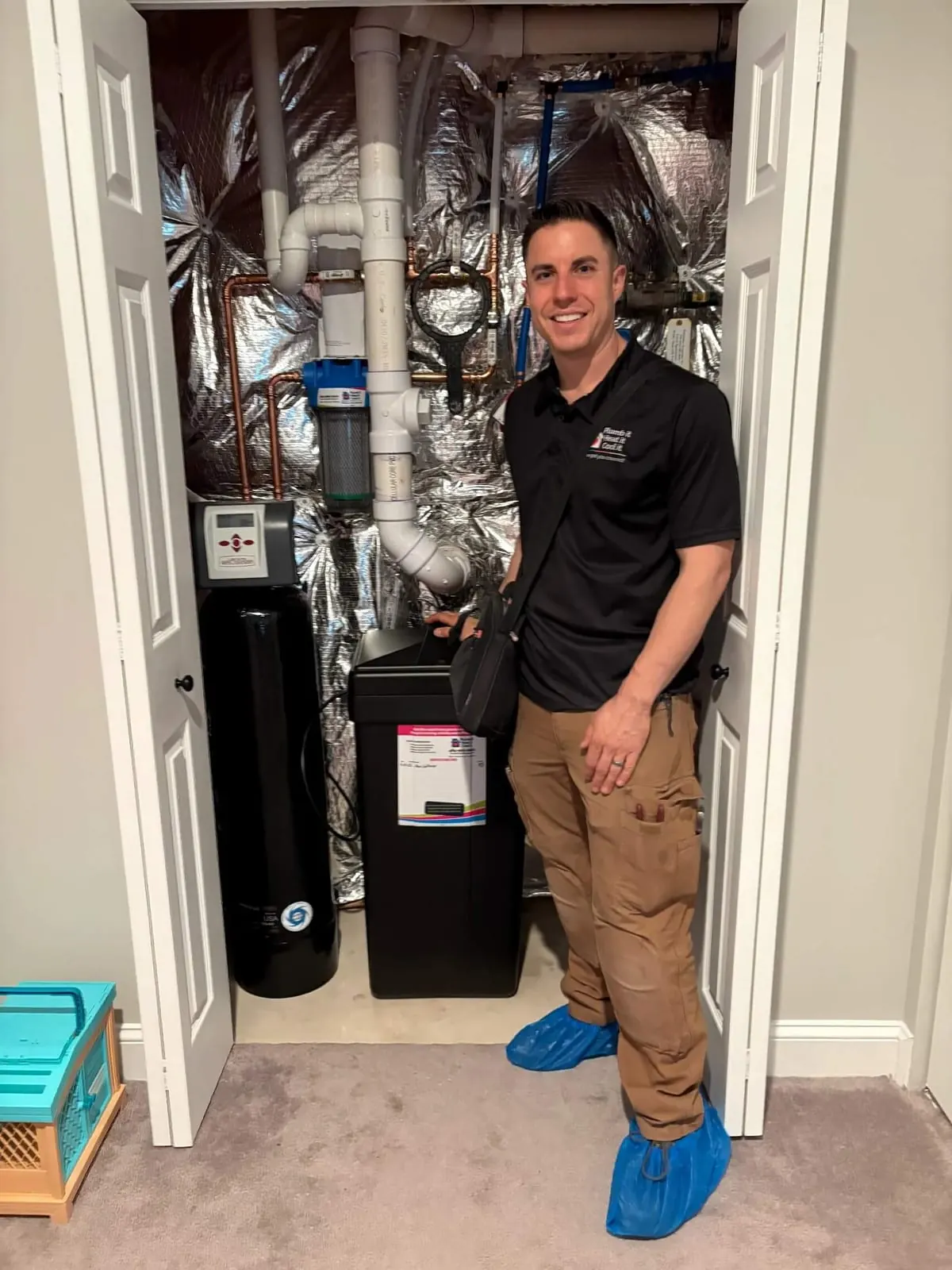 Licensed Plumb it Heat it Cool it plumber completing water treatment
